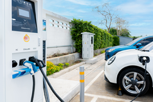 two electric vehicles charging outside_Canva.png