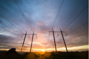 sunset behind power lines